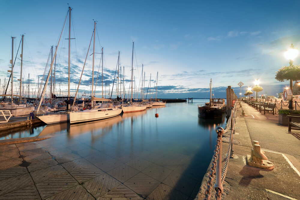 Tranquil English harbour at dusk symbolising stability and lasting legacy