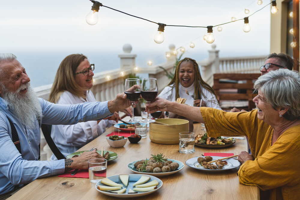 Family and friends sharing a meal together — protecting what matters